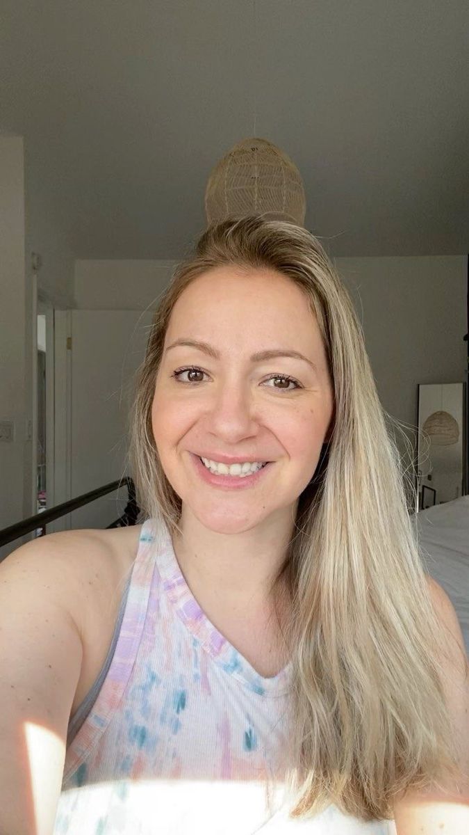 Happy woman enjoying a fresh and clean bathroom environment